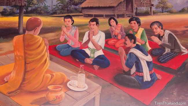 Buddhist temple mural painting of people sitting in front of a monk.