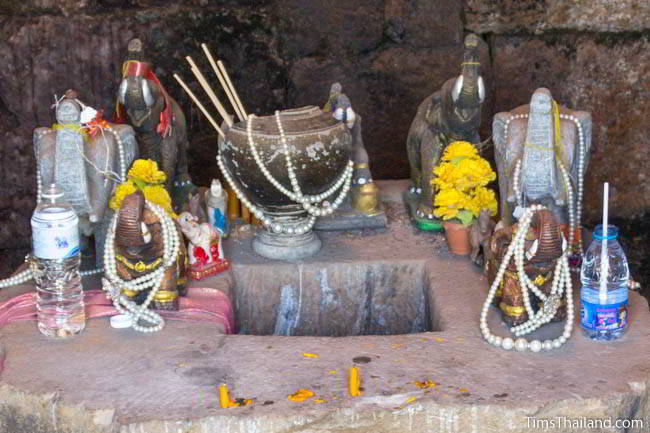 Shrine with ancient Khmer pot in Ban Phluang Khmer ruin in Thailand.