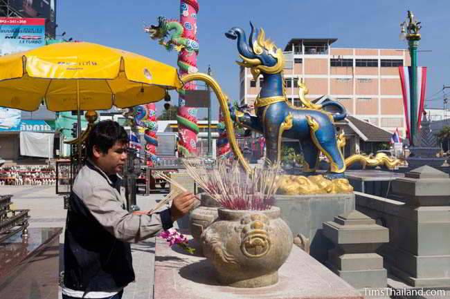 Making an offering in front of a kochasi at current Khon Kaen city pillar shrine