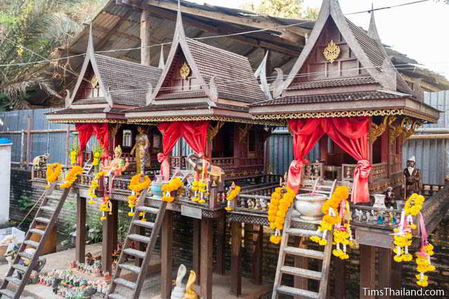 Old spirit houses behind Khon Kaen's Khmer-style Mahesak Shrine