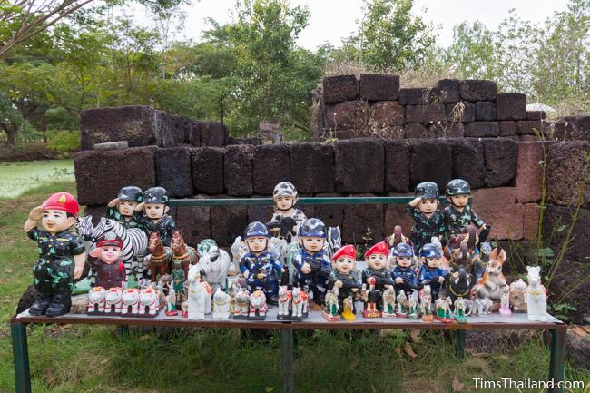 soldier statues in front of Ku Buamat Khmer ruin