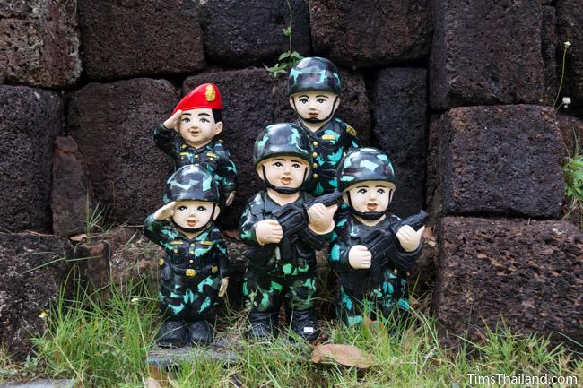 soldier statues in front of Ku Buamat Khmer ruin