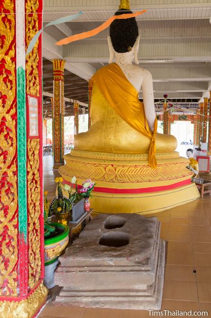 sandstone pedestal of Ku Bueng Jiew Khmer ruin next to buddha statue