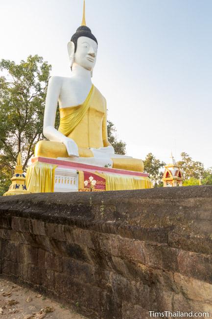 Large Buddha surrounded by laterite enclosure at Ku Sunthararam Khmer Ruin