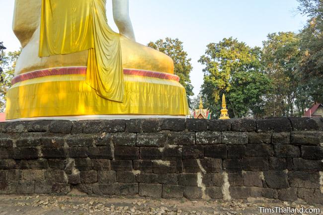 Back of large Buddha surrounded by laterite enclosure at Ku Sunthararam Khmer Ruin