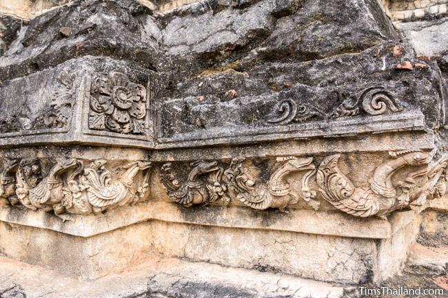 stucco swans at prang wat chulamani khmer ruin