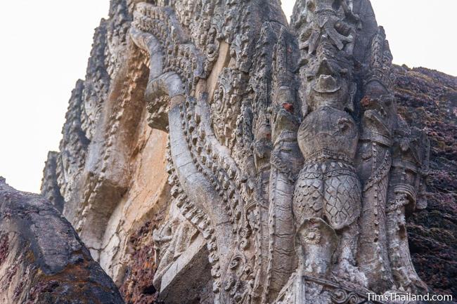 stucco garuda and naga at prang wat chulamani khmer ruin