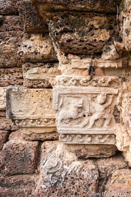 stucco human and animal at prang wat chulamani khmer ruin