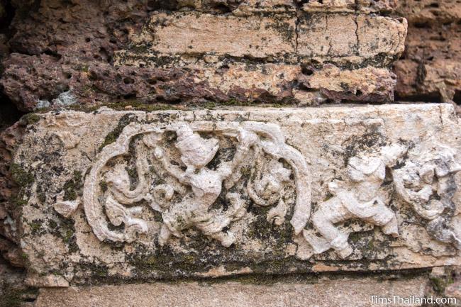 stucco human and garuda at prang wat chulamani khmer ruin