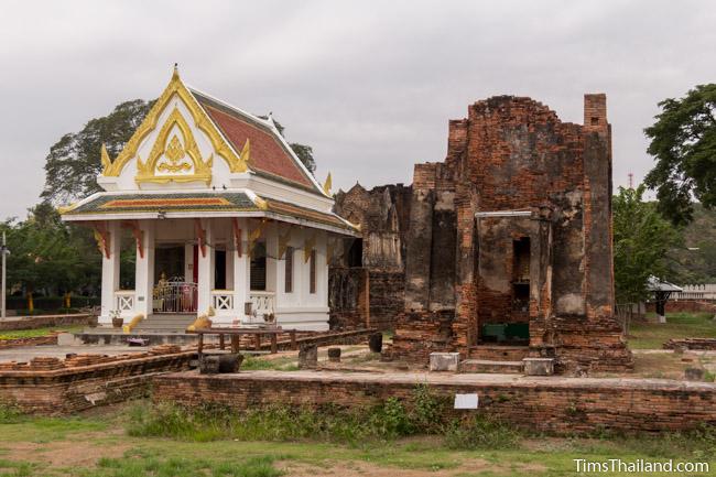 new and old building at prang wat chulamani khmer ruin