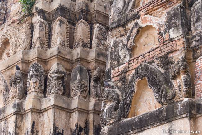 stucco on tower of Wat Si Sawai Khmer ruin