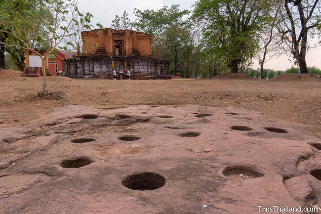 holes in bedrock near Ku Daeng Khmer ruin