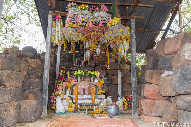 Buddha image inside Prang Ku Kaeng Sanam Nang Khmer ruin