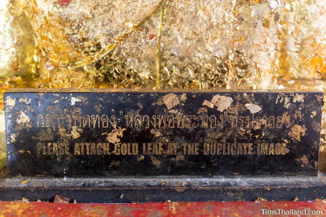 sign below buddha saying gold leaf can be used