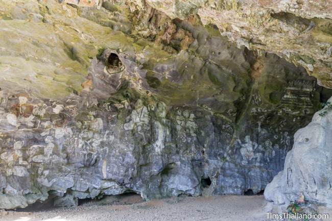 wall of paintings at Tham Sam cave