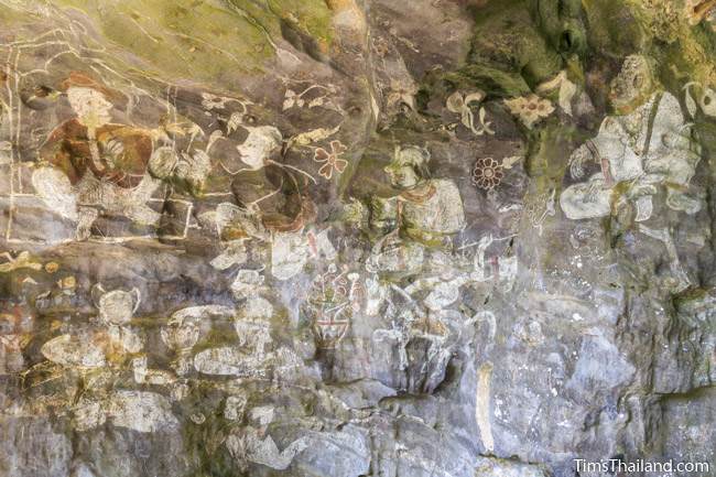 wall of paintings at Tham Sam cave