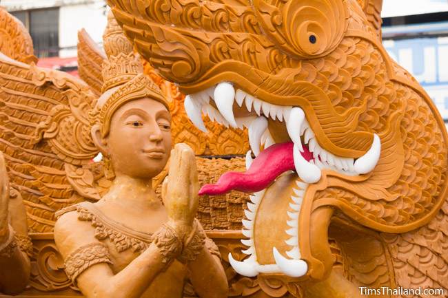 woman and naga on a Khao Phansa candle parade float