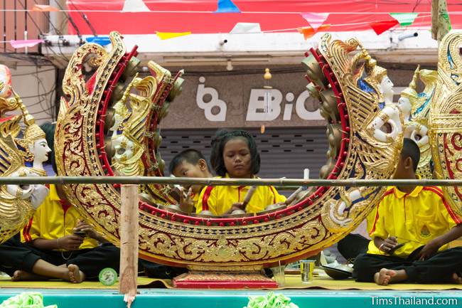 girl playing musical instrument in Khao Phansa candle parade