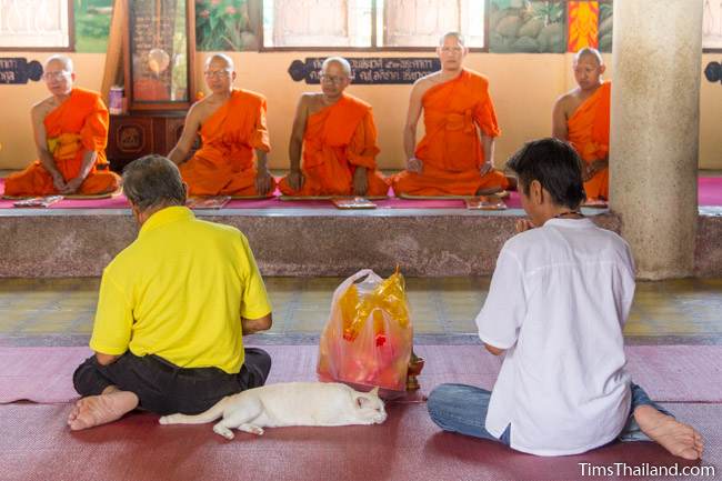 people sitting in front of monks