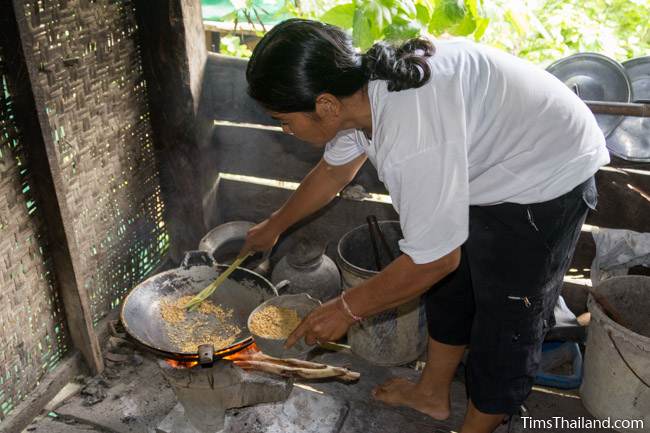 woman roasting puffed rice
