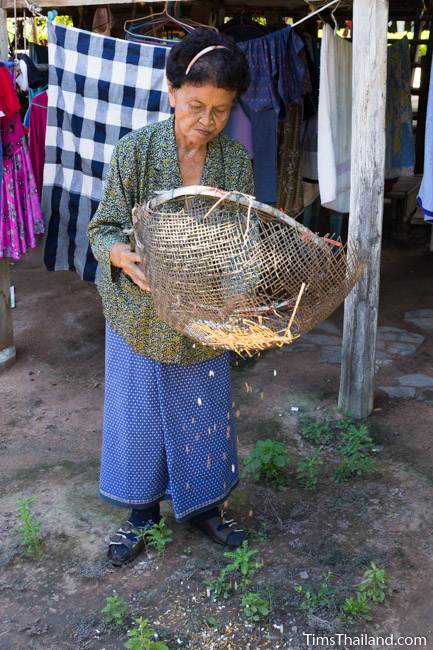 woman winnowing puffed rice