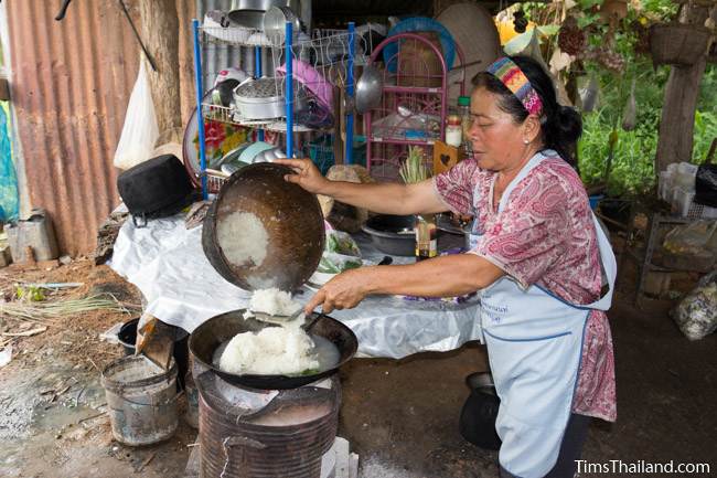 cooking khao tom pat snack during Boon Khao Pradap Din