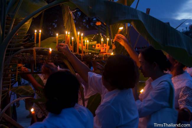 lighting candles during Ok Phansa