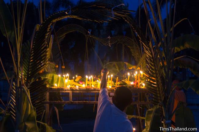 lighting candles during Ok Phansa