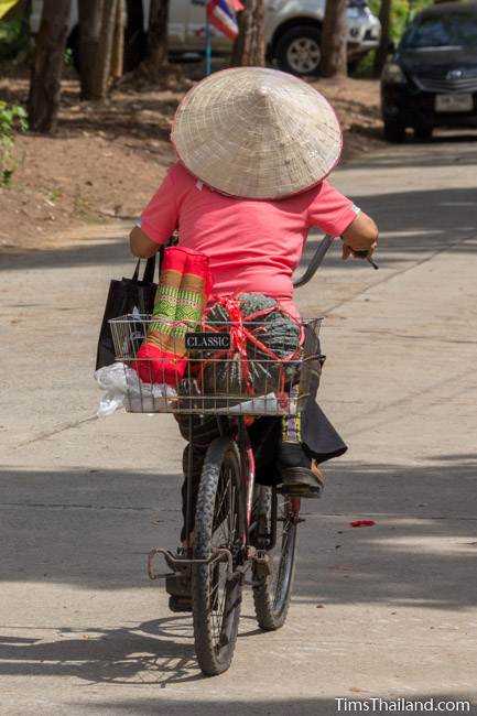 woman riding bike after Kathin celebration