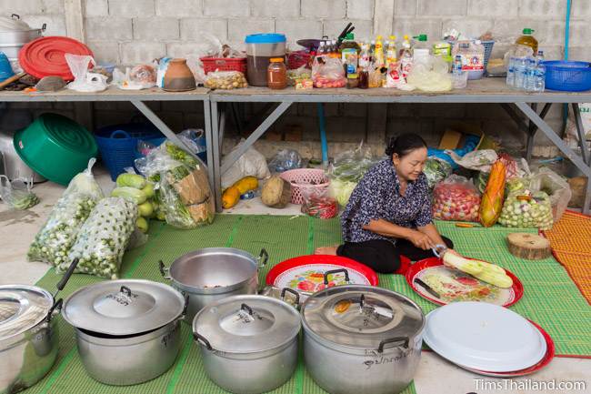 woman cutting papaya for making food for Kathin celebration