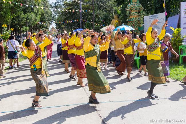 woman dancing at temple for Kathin celebration