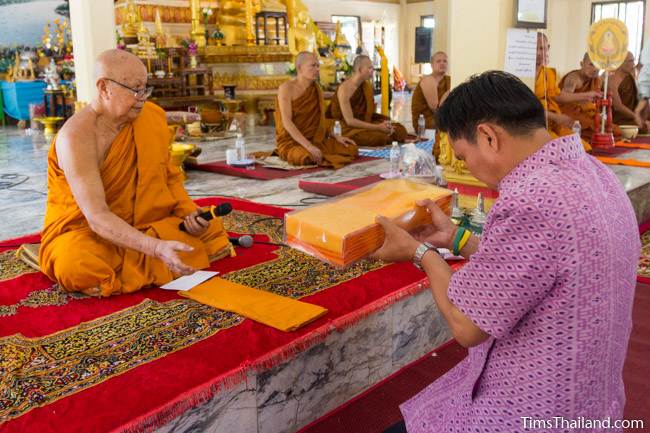 giving a robe to the abbot for Kathin celebration