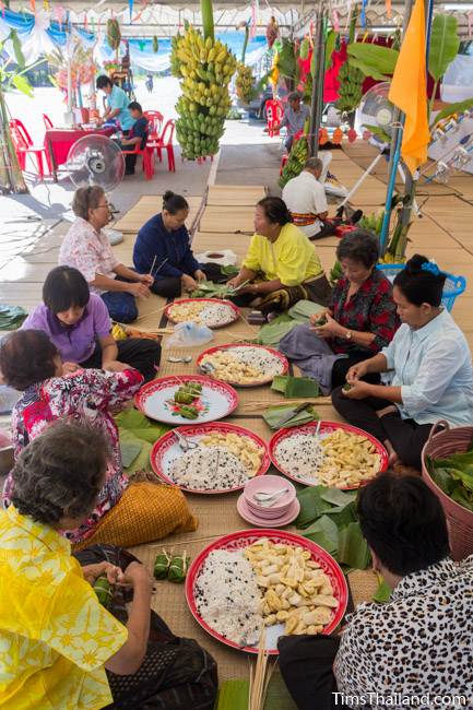 group of women making khao tom mat for Kathin celebration