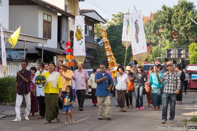 people walking in Kathin celebration parade