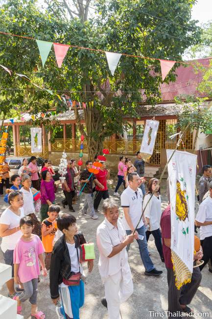 people walking around temple for Kathin celebration