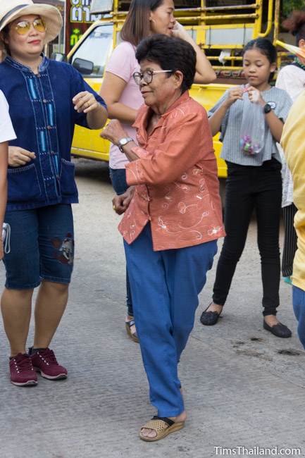 woman dancing in Kathin celebration parade