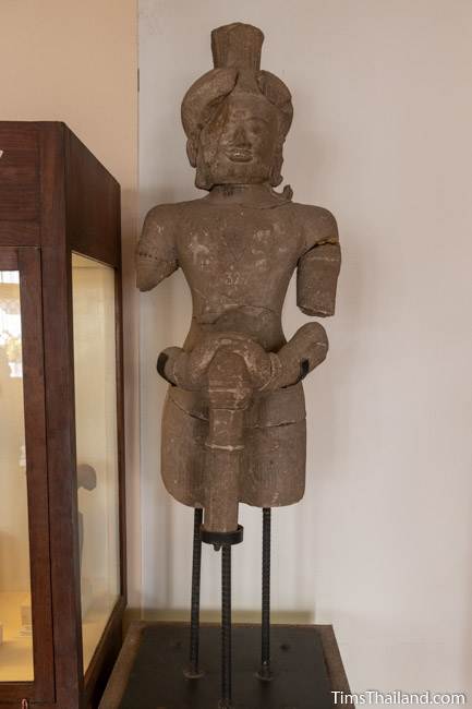 armless and legless dvarapala statue from Prang Krathin Khmer ruin at Maha Viravong National Museum