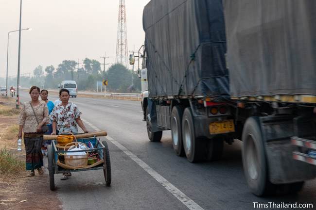 taking things on a cart next to the highway to celebrate Boon Berk Bahn