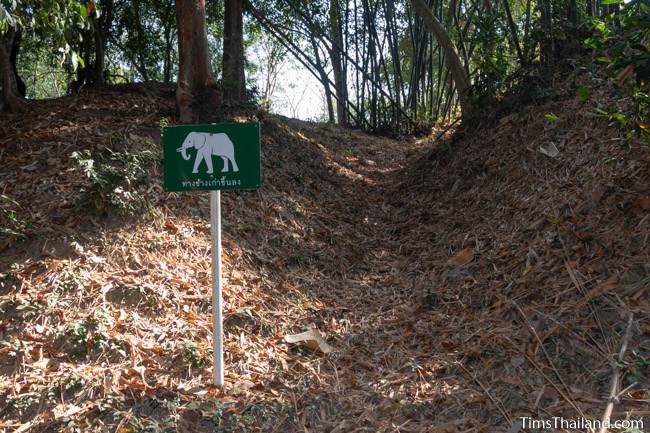 sign at rampart saying old elephant trail at Muang Boran Dong Lakhon