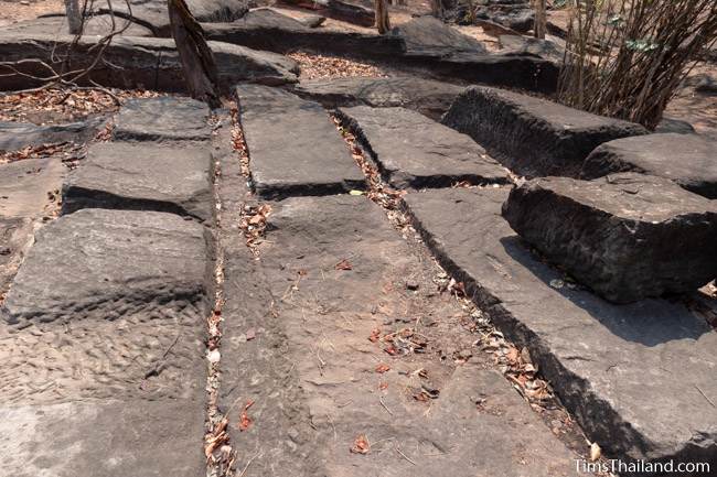 surface of rock where sandstone blocks have been removed