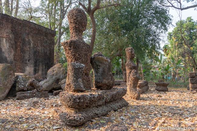 crumbling laterite Buddhas