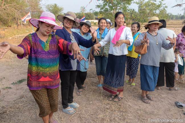 women dancing in rice field