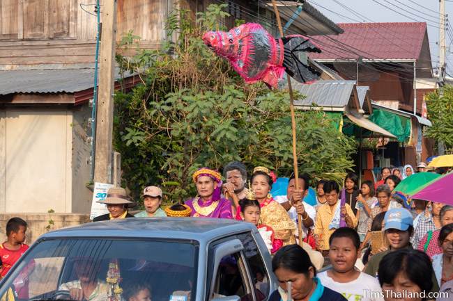 Chuchok and Vessantara and his family riding in back of truck