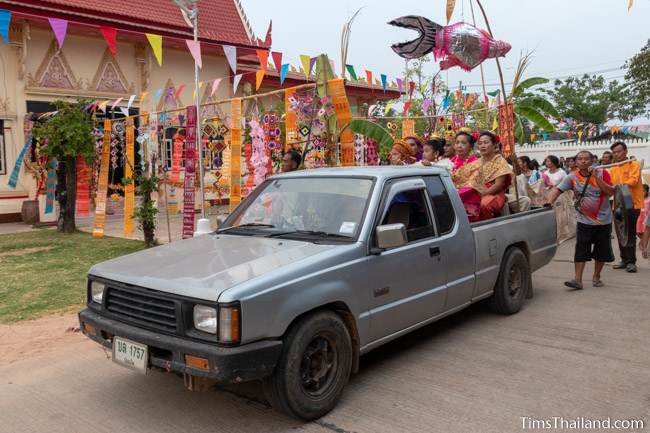 Chuchok and Vessantara and his family riding in back of truck during parade