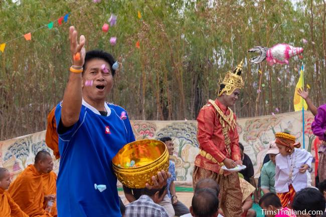 man throwing coins