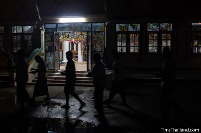 people walking around wihan at night