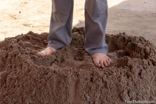 man standing on sand