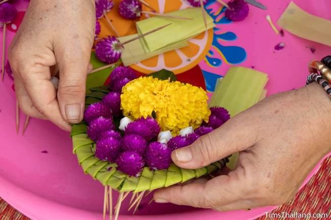 preparing flowers for sand stupas