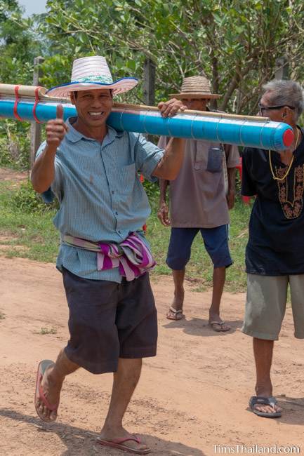 man carrying a rocket