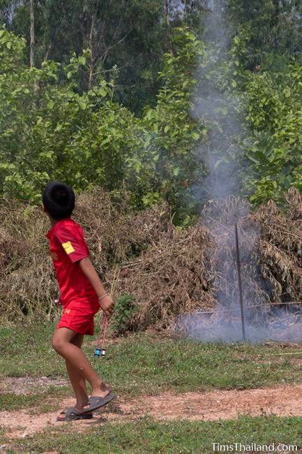 boy launching a mini rocket